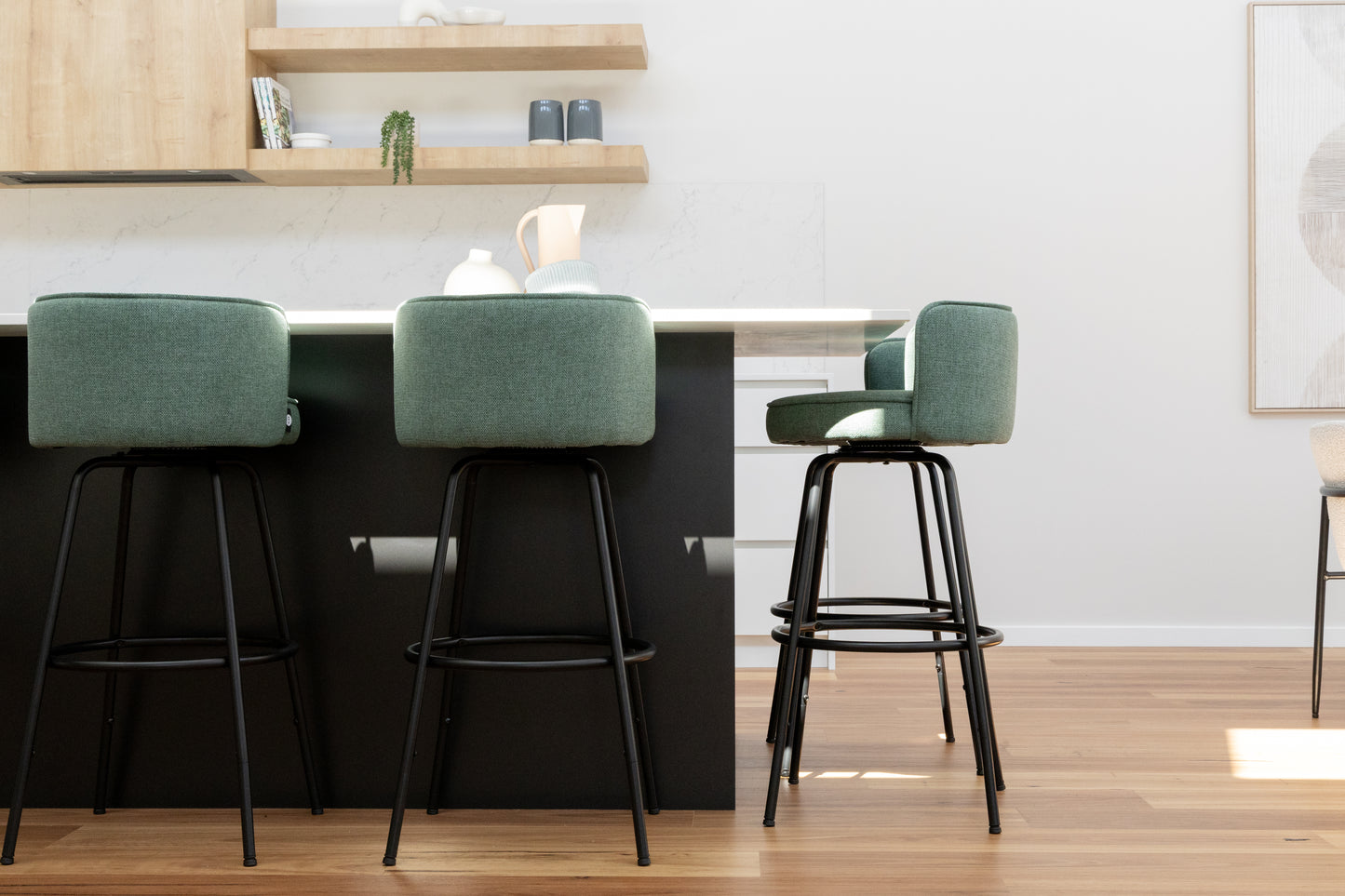 Stylish sara bar stool swivels arranged in a modern kitchen setting