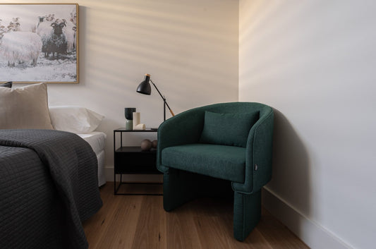 Contemporary armchair with wooden frame and cream fabric