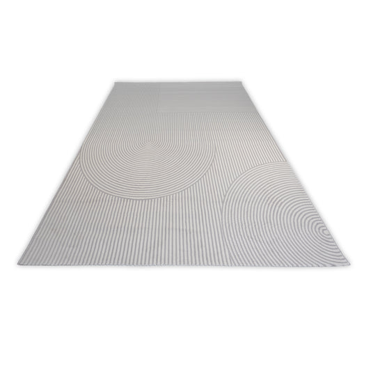 Rectangular grey and cream rug with circular patterns