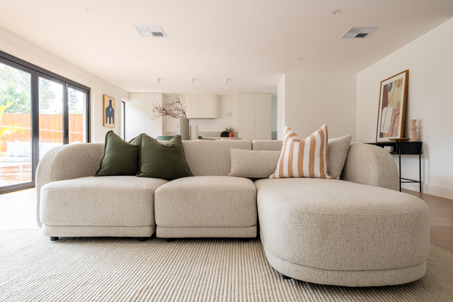 Plush sofa styled in a modern interior setting