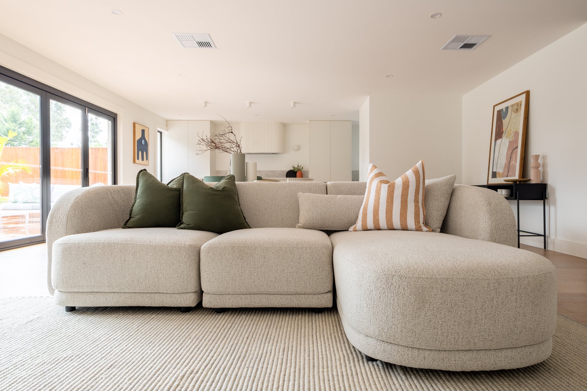 Plush sofa styled in a modern interior setting