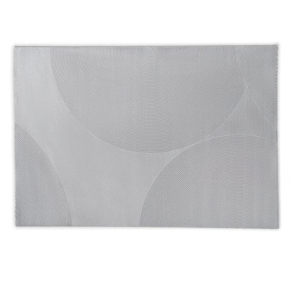 Rectangular grey rug with circular patterns on a light grey background