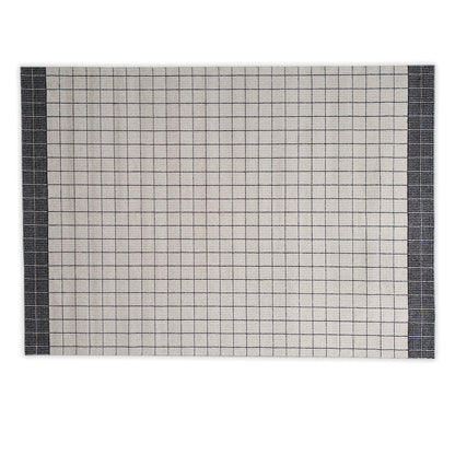 Cream and black lined rug